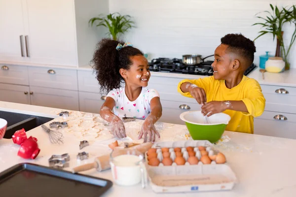 depositphotos_508559820-stock-photo-happy-african-american-siblings-baking